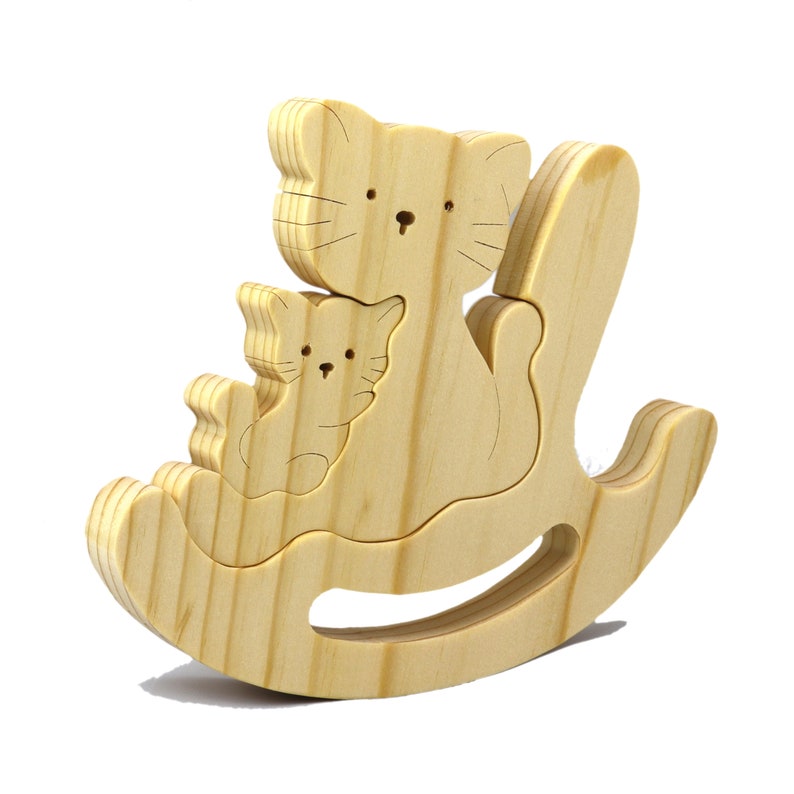 Handmade Wood Puzzle featuring Moma Cat and Baby Kitten in a Rocker, a simple three-part design crafted with traditional woodworking tools. Smoothly sanded and finished with a blend of mineral oil and beeswax for a lustrous touch.