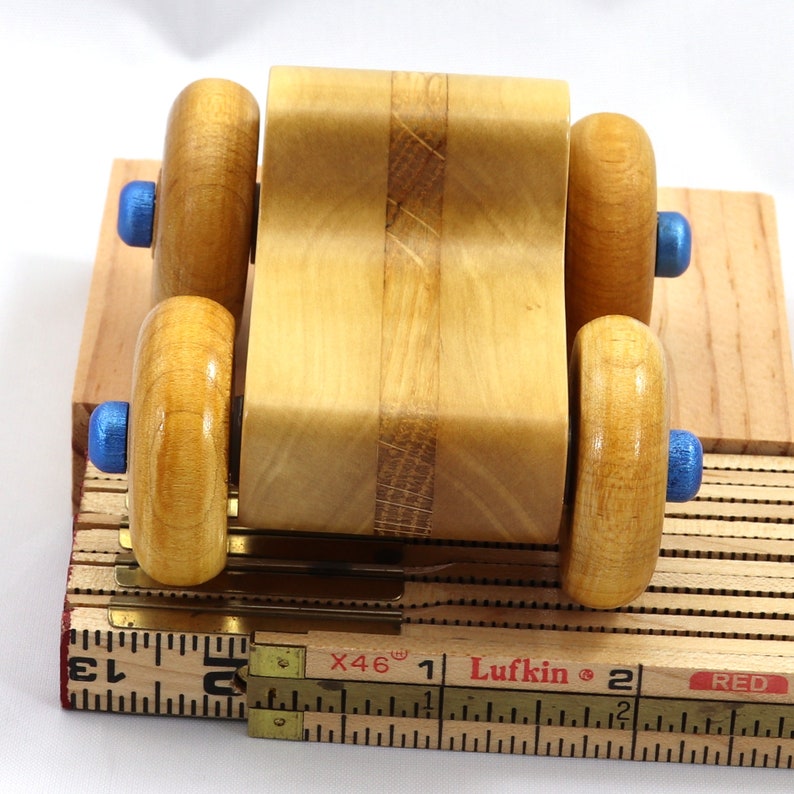 Handmade wooden toy pickup truck with a durable satin polyurethane finish and metallic sapphire blue trim from My Play Pal collection.