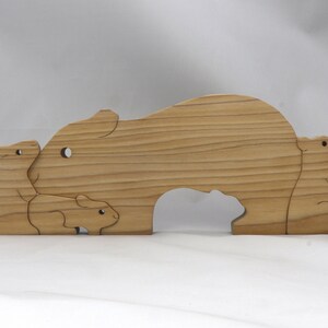 Handmade Wooden Stacking Puzzle Guinea Pig Family, Mom, and Babies finished with a non-toxic custom blend of mineral oil and waxes. This wooden toy animal is perfect for imaginative play and an excellent gift for children.