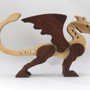 Handmade wood dragon figurine made from select grade contrasting hardwoods and hand-finished with a custom mixture of mineral oil and waxes.