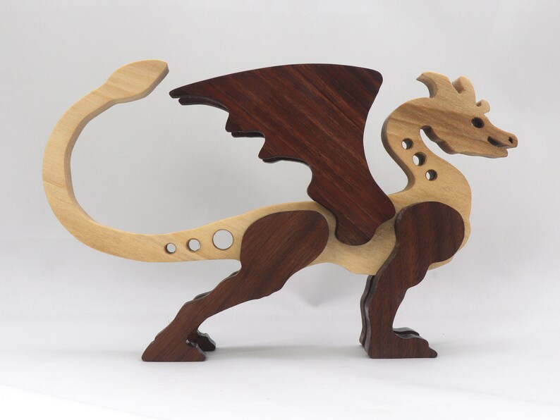Handmade wood dragon figurine made from select grade contrasting hardwoods and hand-finished with a custom mixture of mineral oil and waxes.