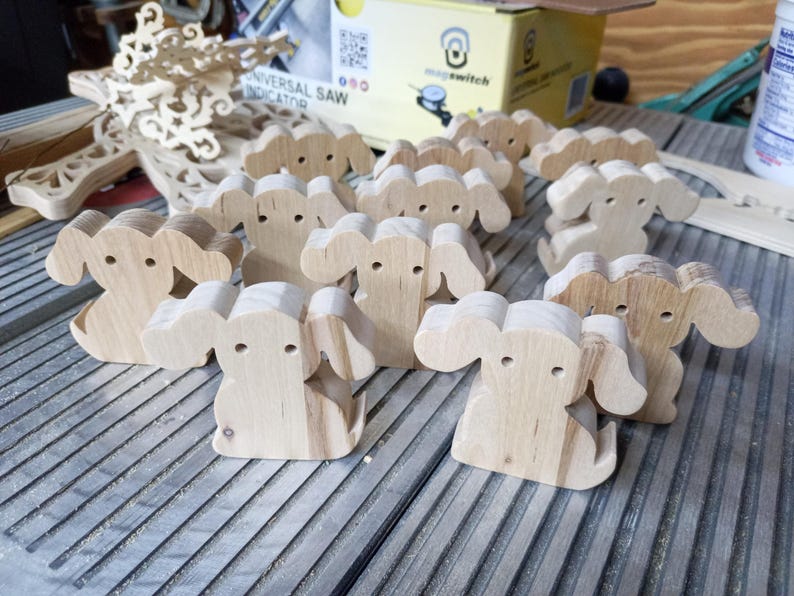 This is an unfinished wooden Puppy Dog cutout from solid wood using traditional woodworking techniques. Sanded smooth and ready to paint, stain, or customize. Freestanding design for small hands, toddlers, young children, crafters, collectors, and display. I take custom orders for any animal, quantity, and mix — including large ornament orders. Mix and match, request a different size, or send a drawing or pattern. Handmade by Odin's Toy Factory in Tallahassee, Florida, USA.