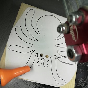 Handmade unfinished wooden Halloween spider cutout from Odin's Toy Factory Snazzy Spooks Collection. Solid wood hand-cut spider, paintable, freestanding design. Approximate size 3.5 inches height by 3.5 inches width by 0.75 inches thick. Made in Tallahassee, Florida, USA.
