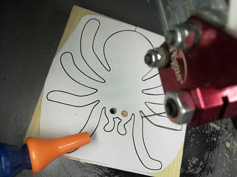 Handmade unfinished wooden Halloween spider cutout from Odin's Toy Factory Snazzy Spooks Collection. Solid wood hand-cut spider, paintable, freestanding design. Approximate size 3.5 inches height by 3.5 inches width by 0.75 inches thick. Made in Tallahassee, Florida, USA.