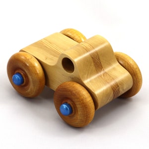 Handmade wooden toy pickup truck with a durable satin polyurethane finish and metallic sapphire blue trim from My Play Pal collection.
