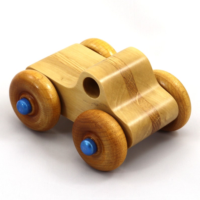 Handmade wooden toy pickup truck with a durable satin polyurethane finish and metallic sapphire blue trim from My Play Pal collection.