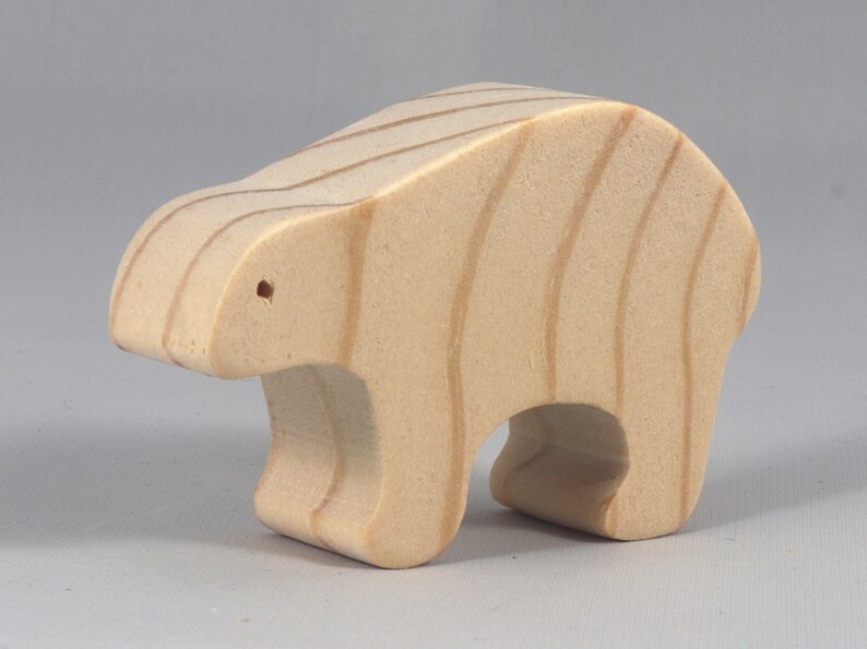 This is an unfinished wooden bear cutout from solid wood using traditional woodworking techniques. Sanded smooth and ready to paint, stain, or customize. Freestanding design for small hands, toddlers, young children, crafters, collectors, and display. I take custom orders for any animal, quantity, and mix — including large ornament orders. Mix and match, request a different size, or send a drawing or pattern. Handmade by Odin's Toy Factory in Tallahassee, Florida, USA.
