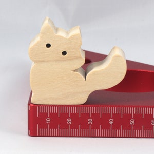 Handmade and unfinished, this stackable toy kitten cat cutout is ready to paint. This unpainted cutout is an excellent option for a fun DIY project or as a pretend toy for children. Available in several sizes, including custom orders.