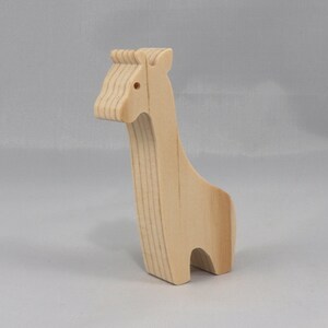 Handmade wooden giraffe cutout, unfinished, ready to paint, and freestanding. Perfect for a young child's imaginative play, stacking, or crafting.