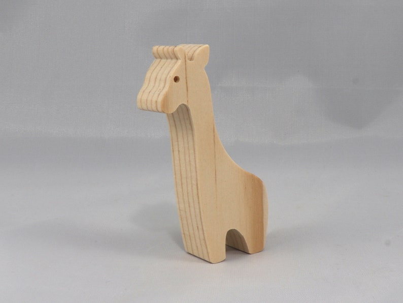 Handmade wooden giraffe cutout, unfinished, ready to paint, and freestanding. Perfect for a young child's imaginative play, stacking, or crafting.