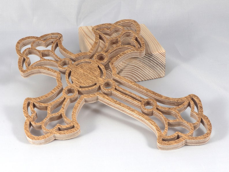 This beautiful handmade rustic fretwork cross is made from reclaimed hardwood flooring samples and adds a touch of rustic elegance to your home.