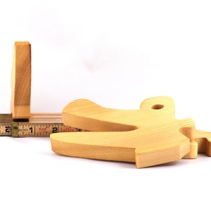 A 10-inch long wooden alligator puzzle for younger kids handmade and smoothly finished. This simple puzzle has three pieces, easy-to-grasp, interlocking, chunky, freestanding pieces. It is made to order.