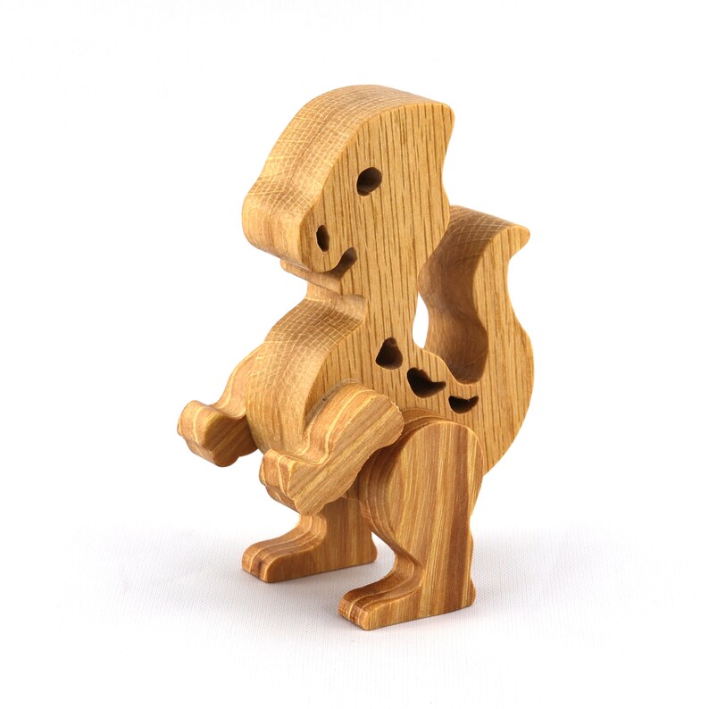 Wooden baby dinosaur figurine from My Buddies Dinos collection. Handmade with select grade hardwoods and finished with mineral oil and beeswax.