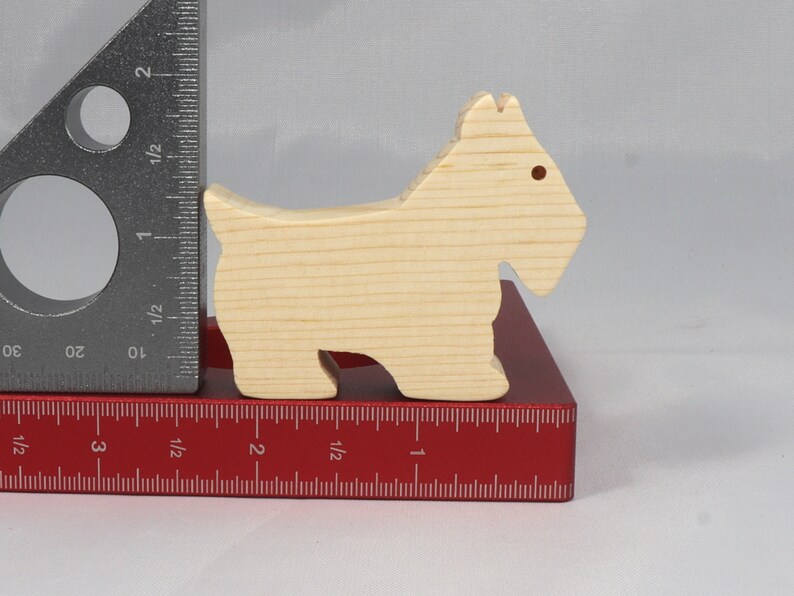 Handmade wood toy Scottie dog cutout unfinished unpainted paintable freestanding Itty Bitty Animal Collection. Approximate size 2.5 inches length by 2 inches height by 0.75 inches width. Handmade in Tallahassee Florida USA from natural wood offcuts.