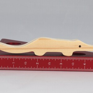 Handmade toy alligator cutout from the Itty Bitty Animal Collection. Crafted with traditional woodworking tools, this unfinished wood alligator is freestanding, smooth-sanded, and ready to paint. Perfect for stacking and imaginative play.