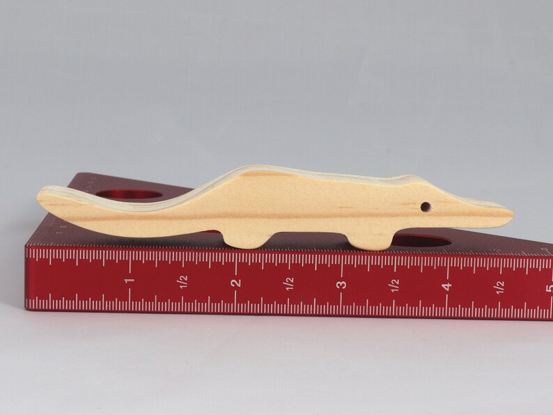 Handmade toy alligator cutout from the Itty Bitty Animal Collection. Crafted with traditional woodworking tools, this unfinished wood alligator is freestanding, smooth-sanded, and ready to paint. Perfect for stacking and imaginative play.