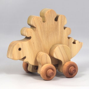 Handmade push toy stegosaurus crafted from select grade hardwoods and finished with a non-toxic coating.