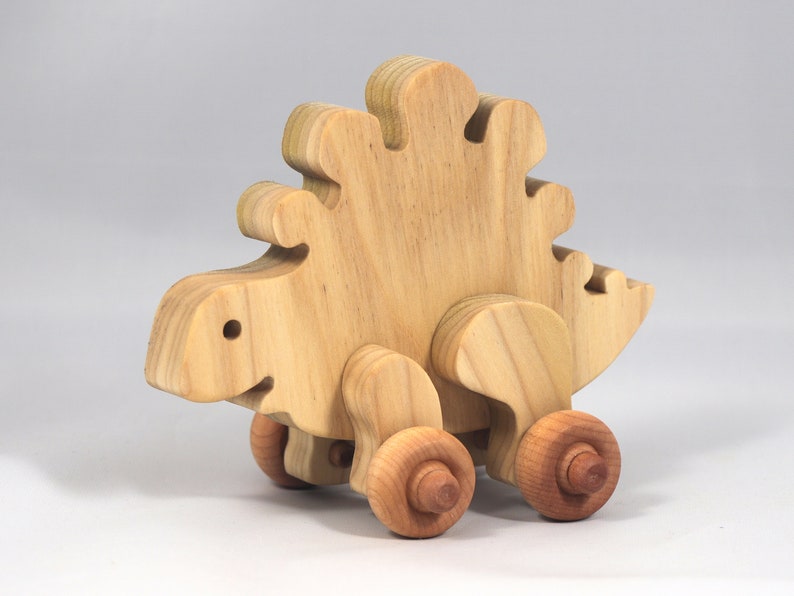 Handmade push toy stegosaurus crafted from select grade hardwoods and finished with a non-toxic coating.