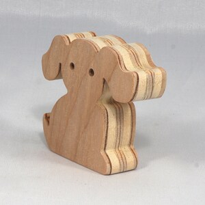 Handmade, stackable toy puppy dog cutout from the Itty Bitty Animal Collection. Unfinished and unpainted, crafted for creative play. Smoothly sanded and ready to be personalized with your favorite colors.
