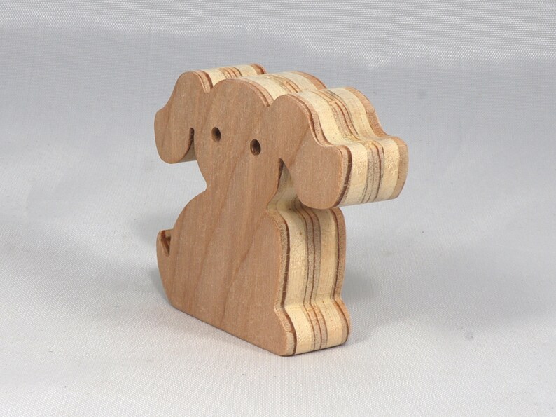 Handmade, stackable toy puppy dog cutout from the Itty Bitty Animal Collection. Unfinished and unpainted, crafted for creative play. Smoothly sanded and ready to be personalized with your favorite colors.