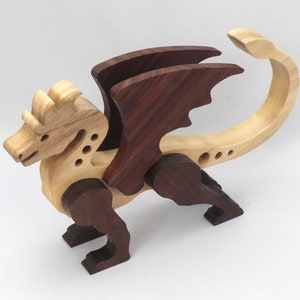 Handmade wood dragon figurine made from select grade contrasting hardwoods and hand-finished with a custom mixture of mineral oil and waxes.