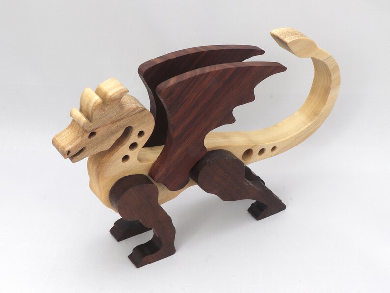 Handmade wood dragon figurine made from select grade contrasting hardwoods and hand-finished with a custom mixture of mineral oil and waxes.