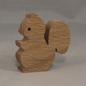 Handmade wood toy squirrel cutout is unfinished, unpainted, paintable, ready to paint, and freestanding from my Itty Bitty Animal Collection.
