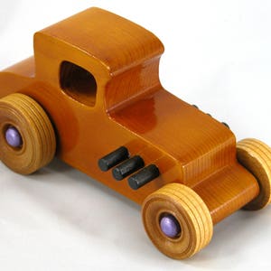 Handmade wooden toy car '27 T-Coupe, finished with amber shellac, metallic purple, and black acrylic paint. Made to order.