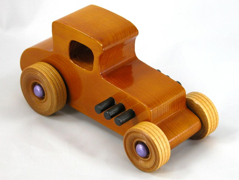 Handmade wooden toy car '27 T-Coupe, finished with amber shellac, metallic purple, and black acrylic paint. Made to order.