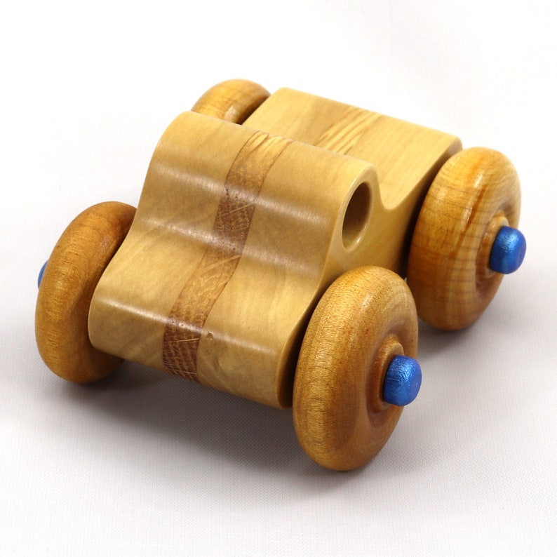 Handmade wooden toy pickup truck with a durable satin polyurethane finish and metallic sapphire blue trim from My Play Pal collection.