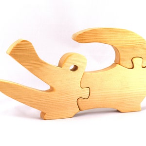 A 10-inch long wooden alligator puzzle for younger kids handmade and smoothly finished. This simple puzzle has three pieces, easy-to-grasp, interlocking, chunky, freestanding pieces. It is made to order.