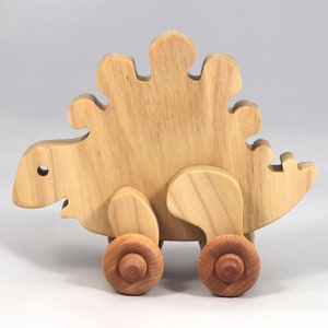 Handmade push toy stegosaurus crafted from select grade hardwoods and finished with a non-toxic coating.