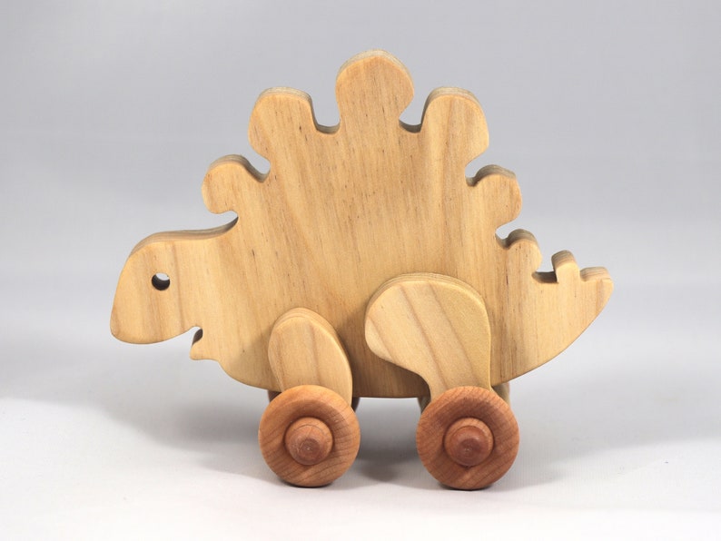 Handmade push toy stegosaurus crafted from select grade hardwoods and finished with a non-toxic coating.