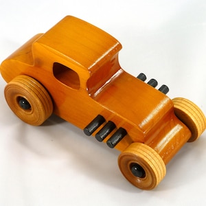 Handmade Wood Toy Car Hot Rod Based On The 1927 T-Coupe. It Has Been Hand-Finished With Multiple Coats Of Amber Shellac And Trimmed With Black Acrylic Paint.