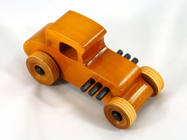 Handmade Wood Toy Car Hot Rod Based On The 1927 T-Coupe. It Has Been Hand-Finished With Multiple Coats Of Amber Shellac And Trimmed With Black Acrylic Paint.