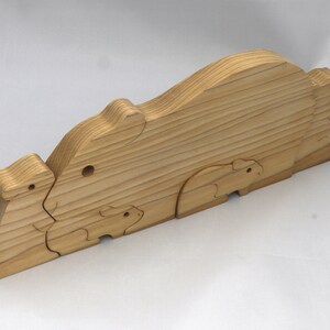 Handmade Wooden Stacking Puzzle Guinea Pig Family, Mom, and Babies finished with a non-toxic custom blend of mineral oil and waxes. This wooden toy animal is perfect for imaginative play and an excellent gift for children.