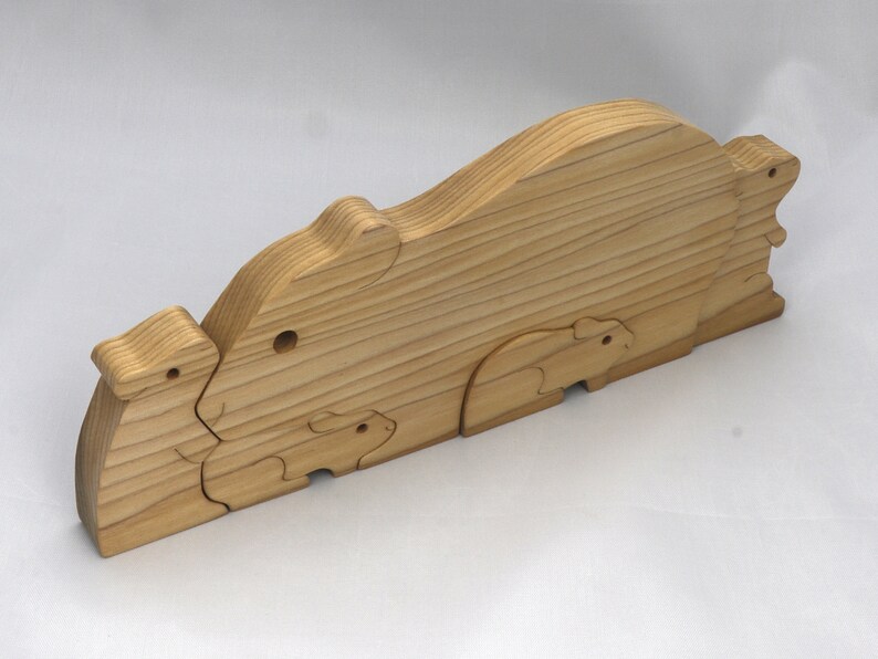 Handmade Wooden Stacking Puzzle Guinea Pig Family, Mom, and Babies finished with a non-toxic custom blend of mineral oil and waxes. This wooden toy animal is perfect for imaginative play and an excellent gift for children.