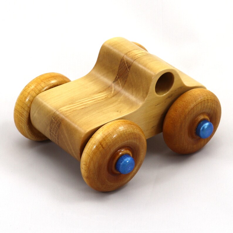 Handmade wooden toy pickup truck with a durable satin polyurethane finish and metallic sapphire blue trim from My Play Pal collection.