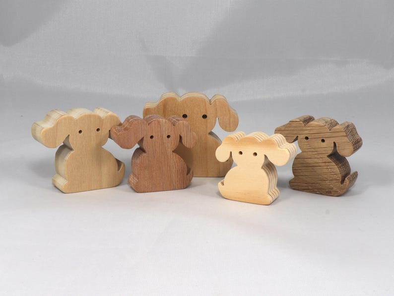 This is an unfinished wooden Puppy Dog cutout from solid wood using traditional woodworking techniques. Sanded smooth and ready to paint, stain, or customize. Freestanding design for small hands, toddlers, young children, crafters, collectors, and display. I take custom orders for any animal, quantity, and mix — including large ornament orders. Mix and match, request a different size, or send a drawing or pattern. Handmade by Odin's Toy Factory in Tallahassee, Florida, USA.