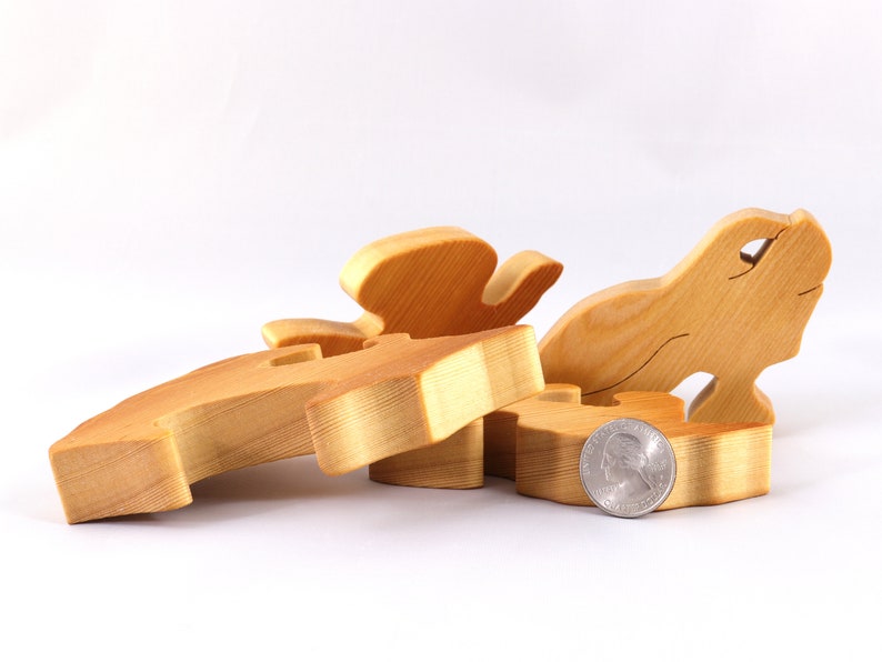A wooden four piece puzzle in the shape of a rabbit. Perfect toddlers first puzzle.
