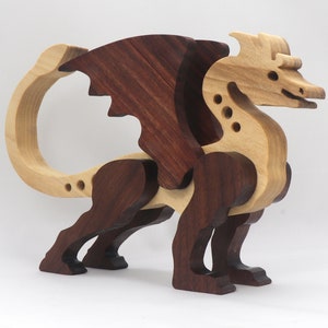 Handmade wood dragon figurine made from select grade contrasting hardwoods and hand-finished with a custom mixture of mineral oil and waxes.