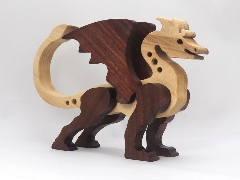 Handmade wood dragon figurine made from select grade contrasting hardwoods and hand-finished with a custom mixture of mineral oil and waxes.