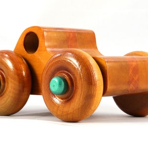 Wood Toy Monster Pickup Truck handmade in the USA from select hardwood finished with amber shellac with metallic emerald green trim. From my Play Pal Collection.