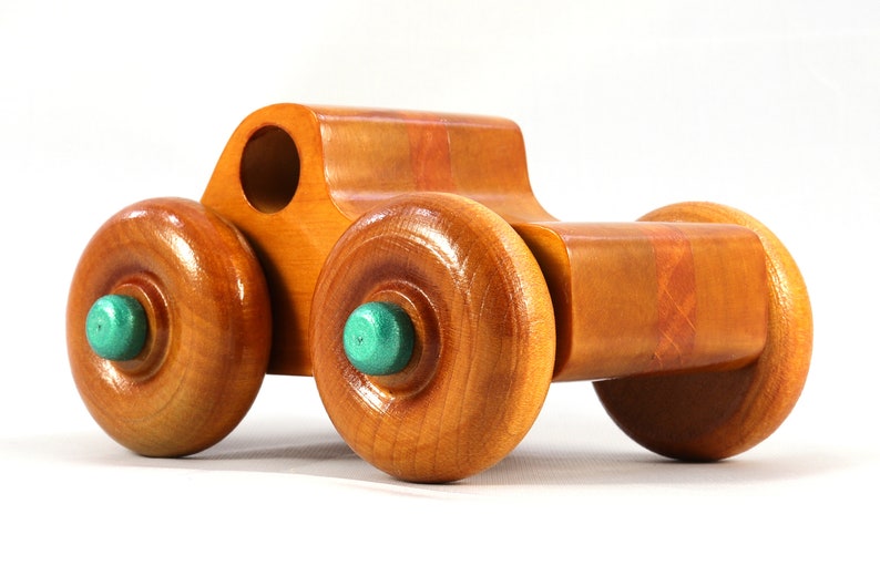 Wood Toy Monster Pickup Truck handmade in the USA from select hardwood finished with amber shellac with metallic emerald green trim. From my Play Pal Collection.