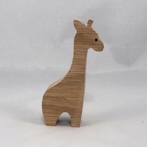 Handmade wooden giraffe cutout, unfinished, ready to paint, and freestanding. Perfect for a young child's imaginative play, stacking, or crafting.