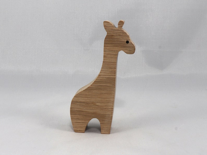 Handmade wooden giraffe cutout, unfinished, ready to paint, and freestanding. Perfect for a young child's imaginative play, stacking, or crafting.