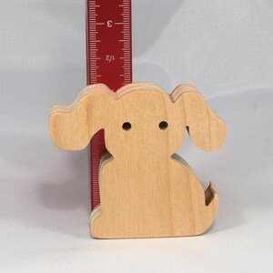 Handmade, stackable toy puppy dog cutout from the Itty Bitty Animal Collection. Unfinished and unpainted, crafted for creative play. Smoothly sanded and ready to be personalized with your favorite colors.