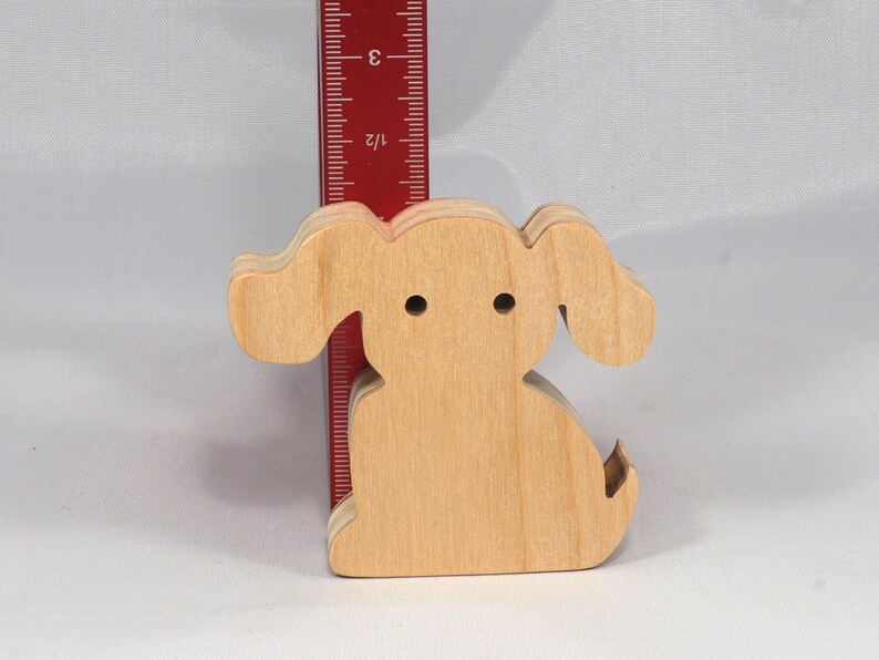 Handmade, stackable toy puppy dog cutout from the Itty Bitty Animal Collection. Unfinished and unpainted, crafted for creative play. Smoothly sanded and ready to be personalized with your favorite colors.