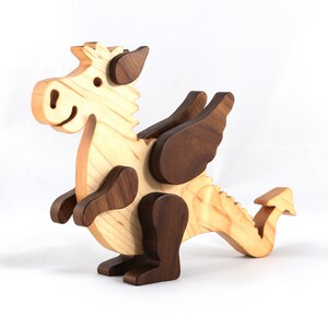 Handmade wood baby dragon fantasy animal figurine made from select grade contrasting hardwoods and hand finished with a durable custom blend of mineral oil and waxes.
