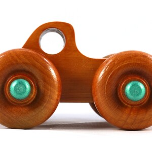 Wood Toy Monster Pickup Truck handmade in the USA from select hardwood finished with amber shellac with metallic emerald green trim. From my Play Pal Collection.